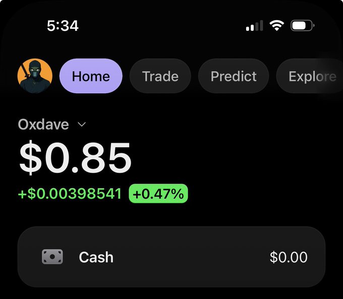 A mobile app screenshot showing a crypto wallet for user 'Oxdave' with a balance of $0.85, up +$0.00398541 (+0.47%), with navigation tabs for Home, Trade, Predict, and Explore.