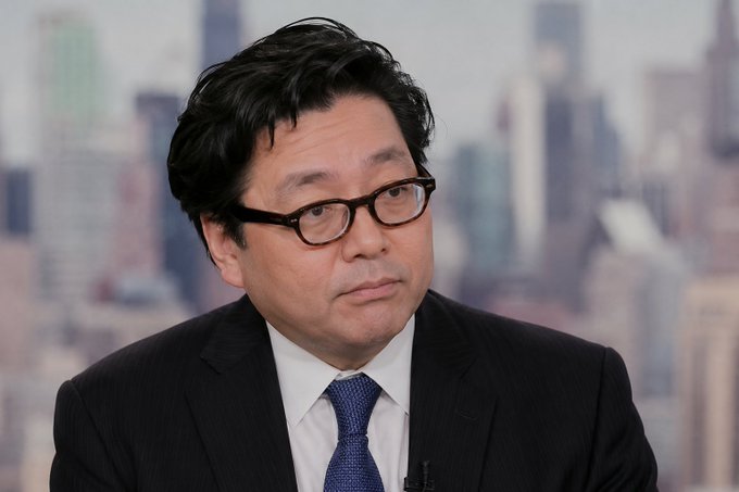 The image shows a man wearing glasses, suit, and tie sitting at a desk facing left with his head turned towards someone. He appears to be focused or engaged in conversation, suggesting he may be discussing something important or work-related. The focus on him emphasizes that whatever is happening or being discussed is of interest to the viewer. The context suggests he might be attending an important meeting, presenting information, or handling a business issue related to Ethereum and Bitcoin.
