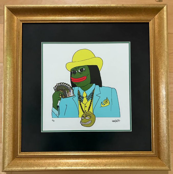 A framed pop-art style illustration depicts the Pepe the Frog character dressed as a wealthy gambler in a blue suit and yellow hat, holding a fan of cash with a gold coin hanging from his neck.