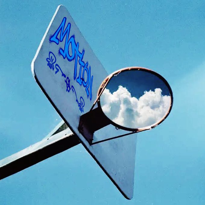 An artistic photo of a rearview mirror reflecting white clouds against a blue sky, with a graffiti-covered street sign in the foreground bearing stylized lettering.