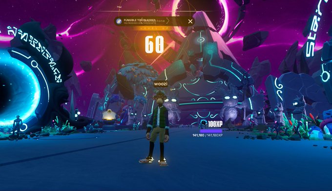 A screenshot from a video game showing a character named 'WOOZI' standing in a vibrant, neon-lit purple arena with alien-like scenery and a 'PURSUE TOXIBADGE' objective on screen.