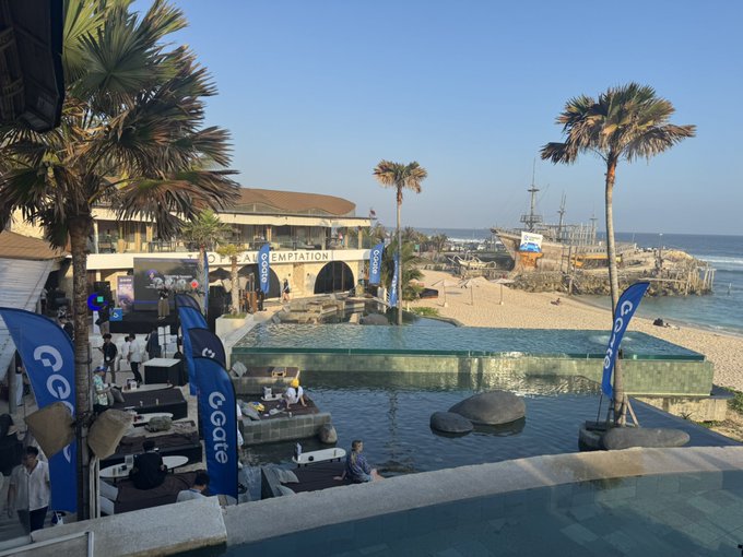 A beachside venue called 'La Brisa' features a pool area with CCafe branded parasols, DJ equipment, and a wooden ship on the nearby shore at sunset.