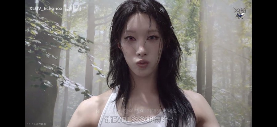 A young woman with wet dark hair stands in a misty forest setting; the image includes the text 'XLOV_Echonox', Korean characters, and Chinese subtitles translating to 'Please look forward to EVOL more~'.