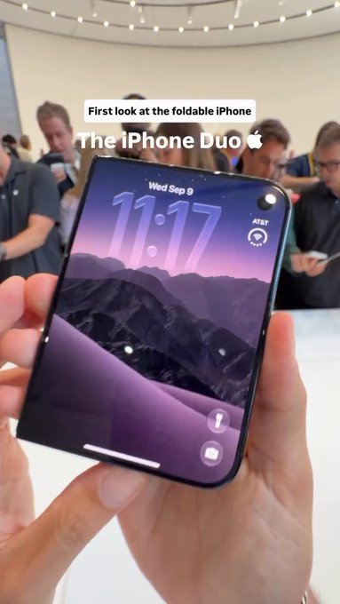 A person holds up a foldable smartphone displaying the time 11:17 on Wed Sep 9, with text reading 'First look at the foldable iPhone' and 'The iPhone Duo 🍎'.