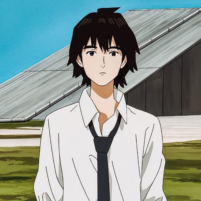 An anime-style illustration of a young man with messy black hair wearing a white collared shirt and a dark tie, standing outdoors in front of a building with a slanted roof.