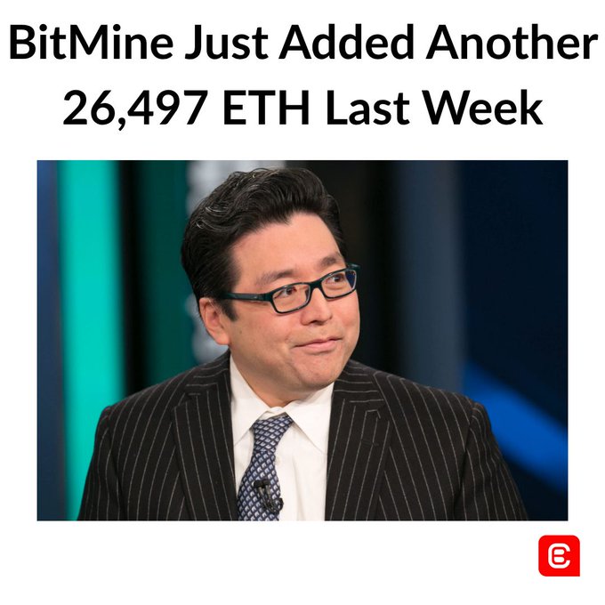 The image features a man wearing a business suit with glasses and a blue and white tie standing against a blue background. The caption below him reads "BitMINE just added another 26,497 Ether Last Week", which seems to be unrelated to the main subject of the photo.