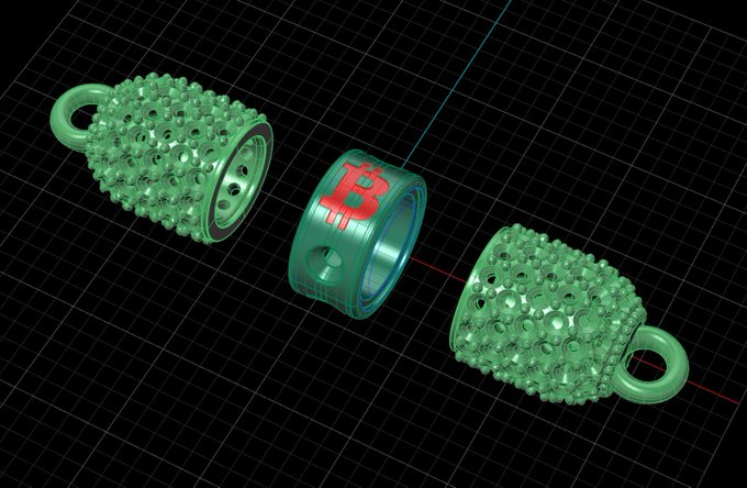 A 3D render of a green Bitcoin symbol shaped like a charm or pendant, featuring two textured, spiky halves connected by a ring engraved with the Bitcoin "₿" symbol, displayed on a dark grid background.