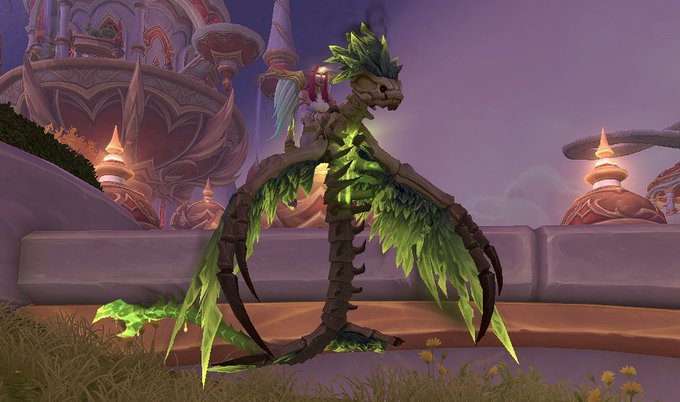 A screenshot from World of Warcraft showing a green and brown bird-like creature (mount) with feathered wings in front of a pink and purple fantasy castle.