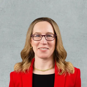 A professional headshot of a woman with shoulder-length blonde hair, wearing glasses, a red blazer over a black top, and a gold chain necklace, photographed against a light blue-gray background.

The image appears to depict SEC Commissioner Hester Peirce, who is referenced in the accompanying post as the official warning that crypto vaults and onchain lending strategies like MORPHO could potentially fall under U.S. securities laws depending on their structure.