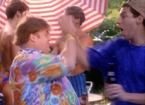 iced tea and beer bottles are scattered on a table, with two men engaged in conversation under an American flag-themed umbrella.