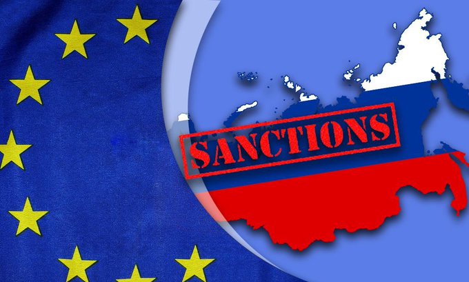 A graphic showing the EU flag alongside a map of Russia colored in the Russian flag colors with a red 'SANCTIONS' stamp across it.