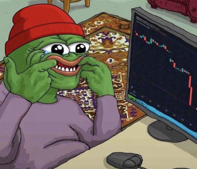 A cartoon Pepe the Frog meme wearing a red beanie and purple hoodie sits at a computer, crying and smiling while staring at a candlestick trading chart showing a sharp decline in red.