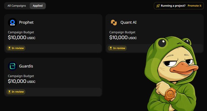 The image shows a cartoon duck wearing a green hoodie and holding a watch. The background of the image is black, making the duck stand out prominently. In the bottom right corner of the image, there's text that reads "gQuack, legend! Urgent update about Select Campaigns!". This suggests that the post has been updated to include new campaign options or information related to selecting campaigns on the platform.