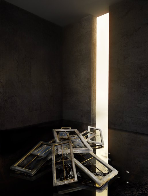 A dark, atmospheric scene shows broken picture frames piled on the floor of a concrete room, with a bright doorway in the background.