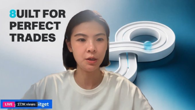 A screenshot from a live stream featuring a woman with the text 'BUILT FOR PERFECT TRADES' alongside a 3D number 8 graphic, showing 27.1K views.