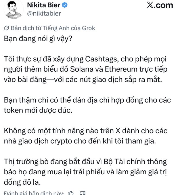 A Vietnamese-language tweet from Nikita Bier (@nikitabier) on X.com, translated from English by Grok, in which he claims credit for building Cashtags, a feature enabling Solana and Ethereum chart embeds and crypto contract addresses in posts on X.