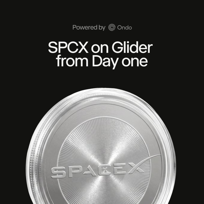 The image features a silver coin with the word "SPACEX" written on it. The coin has a circular shape and is placed against a black background. Below the coin, there's text that reads "The biggest IPO in history is three days away. When SpaceX goes public Friday, SPCXon will be live on Glider day one." This message suggests that the coin might have been minted to commemorate the upcoming launch of a new space venture by SpaceX. The coin could potentially serve as an investment token or collectible item for enthusiasts interested in space exploration and technology.