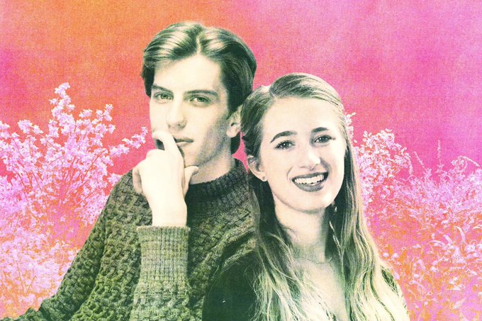 A young man and woman pose closely together against a pink and orange background featuring stylized foliage. The image appears to be a stylized promotional or editorial photo, possibly of a couple, set against a vibrant, artistic backdrop.