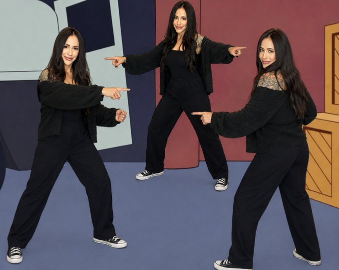 The image features three women wearing black outfits, each pointing towards a different direction with their arms outstretched. They are standing against a backdrop of a cartoon character from "I’ll Keep Accumulating More $XRP". The women appear to be engaged in an activity or posing for the photo, possibly related to the post they have been discussing.

The image is accompanied by text that reads: "I'll keep accumulating more $XRP", which seems to be a reference to Bitcoin or another cryptocurrency.