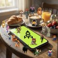 An AI-generated image depicting a charming miniature diorama where tiny figurine characters gather around a smartphone displaying the WhatsApp interface, placed on a dining table with food and decorations.