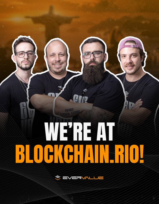 Promotional image featuring four men in black t-shirts announcing 'WE'RE AT BLOCKCHAIN.RIO!' with the EverValue logo, set against a backdrop of Rio de Janeiro's Christ the Redeemer statue.
