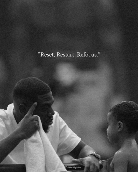 A black-and-white motivational image showing a man wiping his face with a towel while speaking to a young boy, with the quote: 'Reset, Restart, Refocus.'