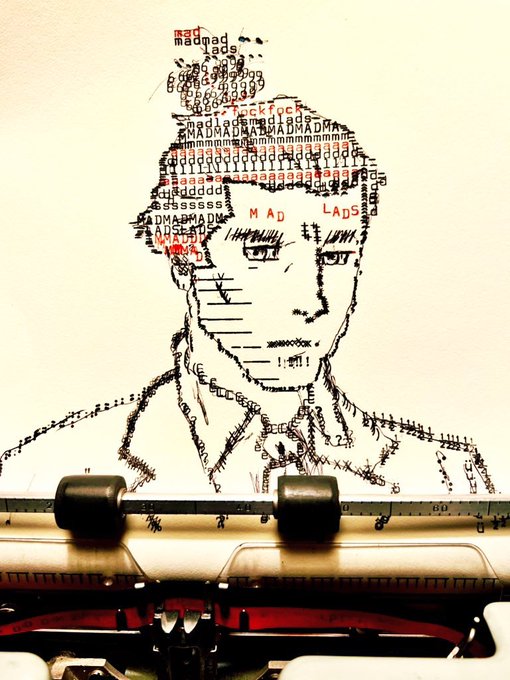 A creative ASCII/typography portrait of a man appearing to emerge from a typewriter, with the text "MAD LADS" formed by various characters.