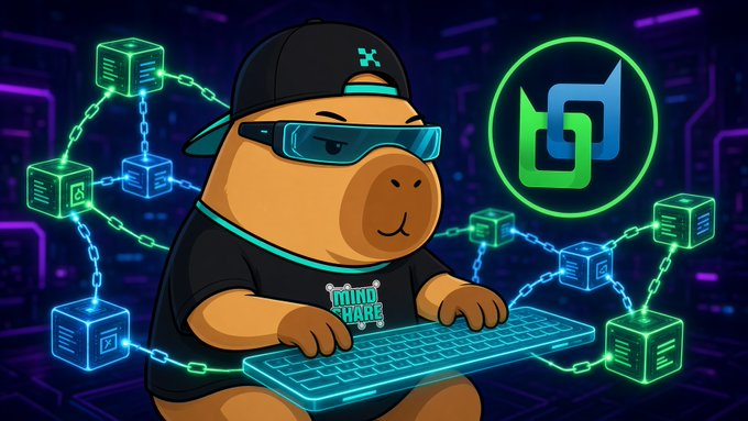 A cartoon capybara wearing a black cap, sunglasses, and a "MIND SHARE" t-shirt types on a glowing keyboard, surrounded by blockchain cubes and a green logo on a cyber-themed background.