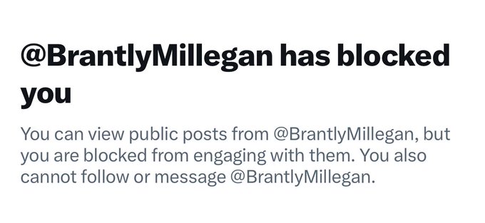 A screenshot showing a Twitter/X notification that '@BrantlyMillegan has blocked you', explaining that you can view public posts but cannot engage with them.