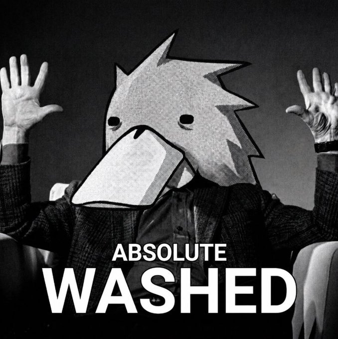 A black-and-white image of a person with hands raised in surrender wearing a spiky cartoon head and a large smartphone/tablet for a mouth, captioned 'ABSOLUTE WASHED'.