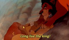 The image features a cartoon scene of two lions fighting over a piece of food. One lion appears larger than the other, with its mouth open wide as if growling or roaring. The text "Long live the king!" is written above them, which could be interpreted as a reference to the iconic movie title "King Kong".