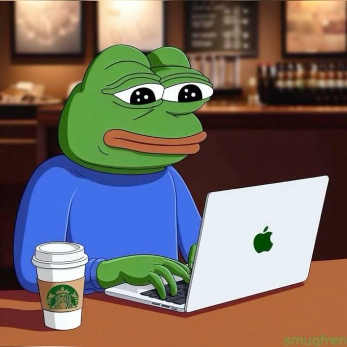 A digital illustration of a green Pepe frog character wearing a blue sweater, typing on a silver Apple MacBook laptop while sitting at a table with a Starbucks coffee cup, signed 'smuqfren'.