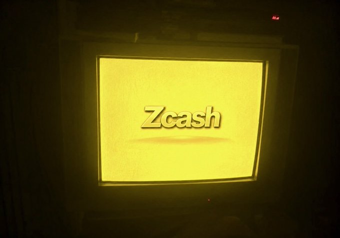 An old CRT television screen displaying the 'Zcash' cryptocurrency logo in gold on a dark background.