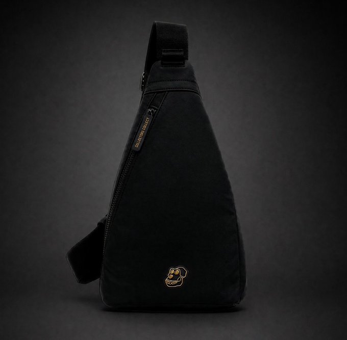 A black sling bag with an orange gorilla logo tag and 'GORILLA DAILY' zipper pull, photographed in profile against a dark background.