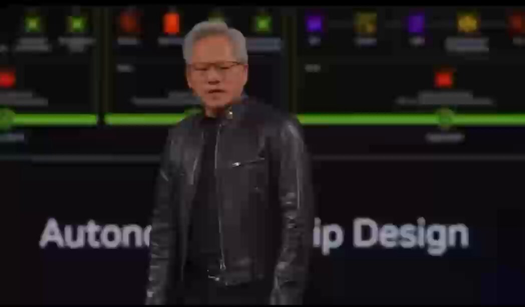 The image features a man wearing glasses, standing in front of a large screen with the words "Autonauticapdesign" displayed above him. The man appears to be speaking or giving a presentation about ServiceNow, as indicated by the text on the screen. The background shows a black wall with various colors and shapes, which could represent different aspects of ServiceNow's capabilities.
