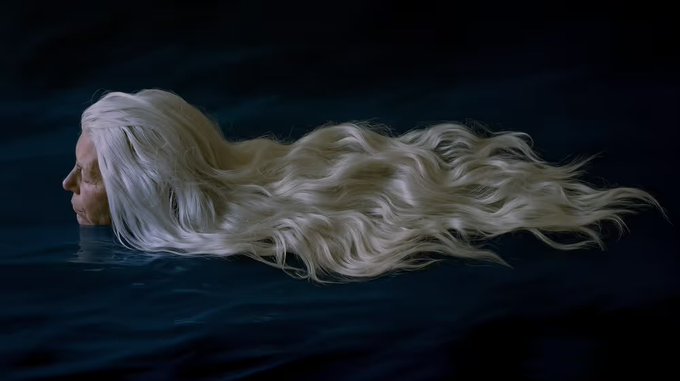 An artistic image of a figure with long flowing platinum blonde hair lying in dark water, reminiscent of Daenerys Targaryen from Game of Thrones.