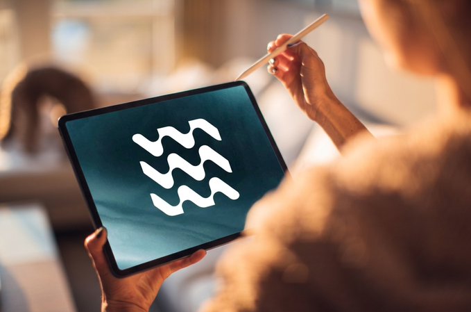 A person holds a tablet displaying a wavy line logo, using a stylus, while bathed in warm light. The image visually represents the post's emphasis on real-time blockchain data analysis through accessible digital tools like @SurfAI, with the tablet serving as a gateway to transparent Web3 research and market insights.
