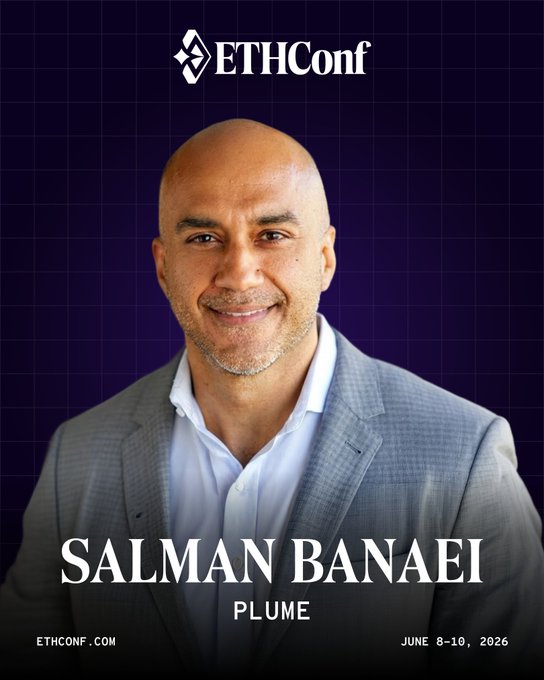 The image features a man wearing a suit jacket with a bald head smiling for the camera. The background of the image is purple, which contrasts with the white text that reads "EITHConf" at the top. Below this, there are two lines of text in black and white, one reading "Salman Banaiel Plume" and another stating "June 8-10, NYC." This suggests that the man is attending an EthCon conference in June in New York City.