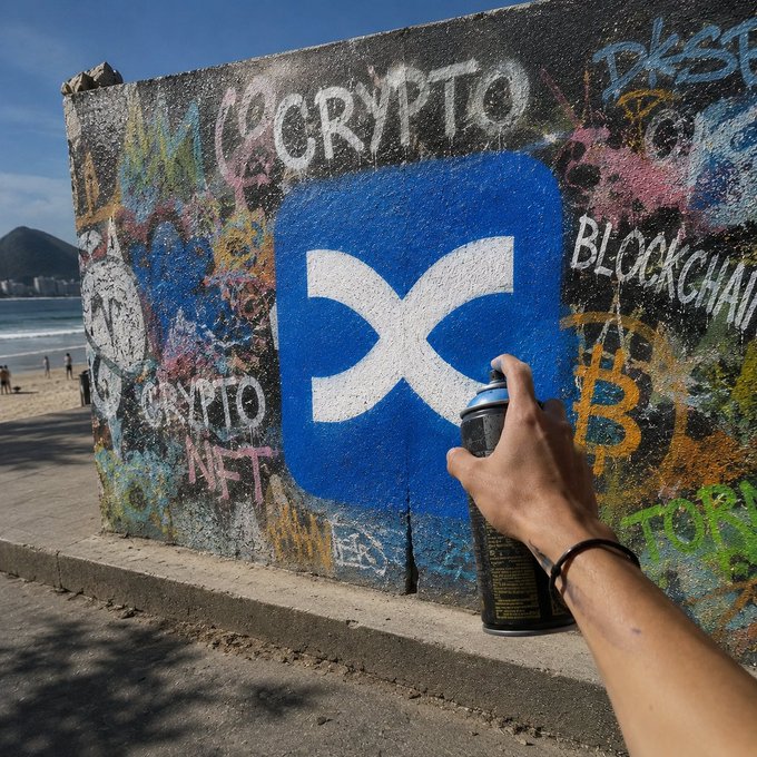 A hand holds a spray paint can in front of a concrete wall covered in graffiti, prominently featuring a large blue X (XRP) logo with the words 'CRYPTO' and 'BLOCKCHAIN' spray-painted around it, with a beach visible in the background.