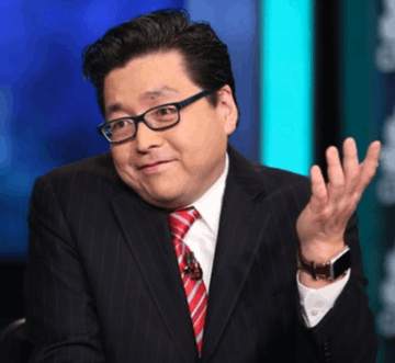 The image shows a man wearing glasses, a dark pinstripe suit, and a red striped tie, gesturing with his hand raised in what appears to be a television studio setting. Given the context of the post, this is likely Tom Lee, the figure associated with Bitmine ($BMNR), whose company recently received a large ETH transfer from BitGo.