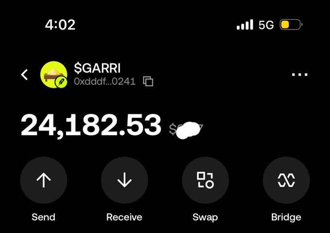 A crypto wallet app screenshot showing a balance of 24,182.53 $GARRI with options for Send, Receive, Swap, and Bridge.