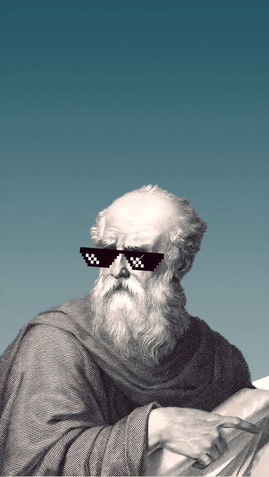 An edited image of a classical statue of a bearded man wearing pixelated 'thug life' sunglasses against a blue sky background.