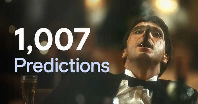 A still image of a man in a tuxedo looking upward with a somber expression, with large text overlay reading '1,007 Predictions'.