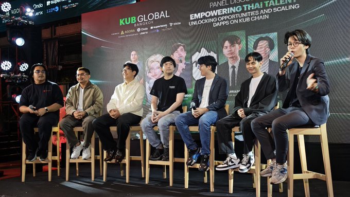 A panel discussion at the 'KUB Global Bangkok' event, titled 'Empowering Thai Talents: Unlocking Opportunities and Scaling DApps on KUB Chain', featuring seven men seated on stools.