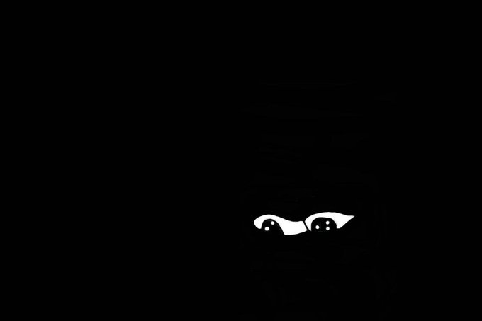 A minimalist black image featuring only the cartoonish white eyes of a face peering up from the bottom edge.