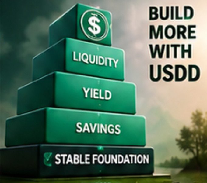 A pyramid of green blocks labeled 'STABLE FOUNDATION', 'SAVINGS', 'YIELD', and 'LIQUIDITY' topped with a dollar sign, alongside the text 'BUILD MORE WITH USDD'.