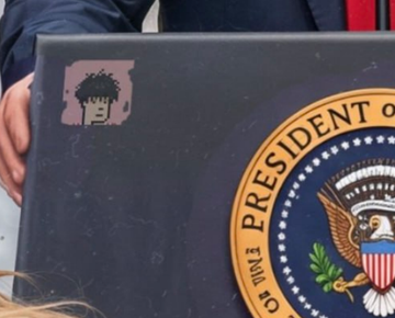 A laptop adorned with a pixelated NFT-style sticker sits next to the official seal of the President of the United States, likely belonging to a press pool photographer. The juxtaposition of crypto/NFT culture imagery with presidential iconography visually ties to the post's emphasis on digital assets like $Zaibatsu and $GME, symbolizing the intersection of meme finance and mainstream political settings.