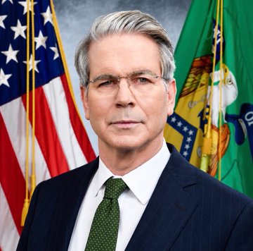 The image shows a portrait of U.S. Treasury Secretary Scott Bessent, who oversees Treasury debt management operations. His role directly relates to the announcement of the $6 billion long-term debt buyback, which the post frames as bullish for Bitcoin ($BTC) due to implications for liquidity and monetary policy.