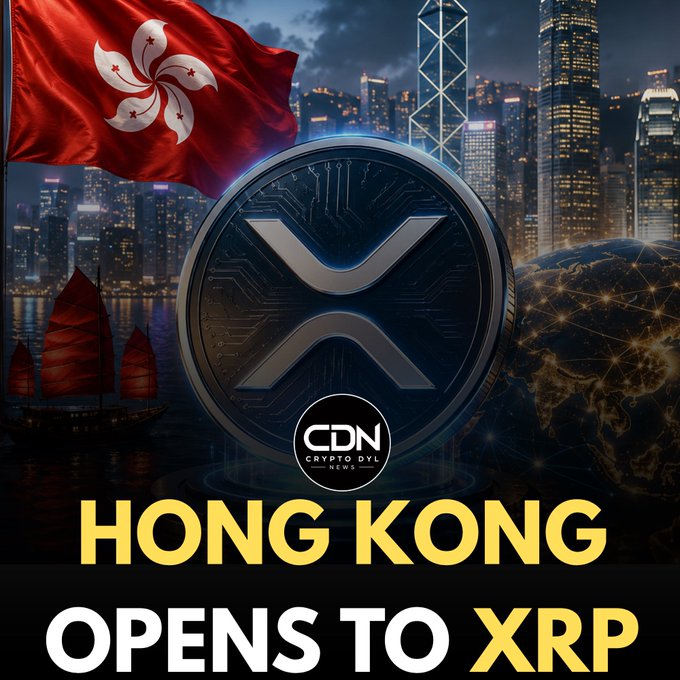The image features a large XRP cryptocurrency coin centered against a nighttime Hong Kong skyline, with the Hong Kong flag waving in the upper left and a traditional Chinese junk boat on the water below. A "CDN Crypto DVL News" logo appears on the coin, and bold yellow and white text at the bottom reads "HONG KONG OPENS TO XRP," visually reinforcing the post's announcement about Hong Kong's embrace of the XRP cryptocurrency.