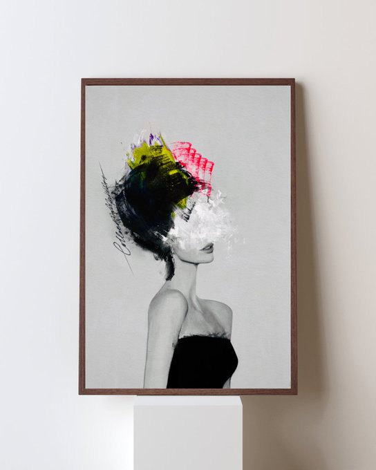 A framed art print of a black-and-white photograph of a woman in a black dress, her face obscured by abstract, expressive splashes of black, yellow, red, and white paint.
